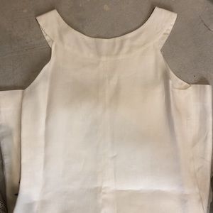 Cute comfortable summer white zipper dress with bow on back.